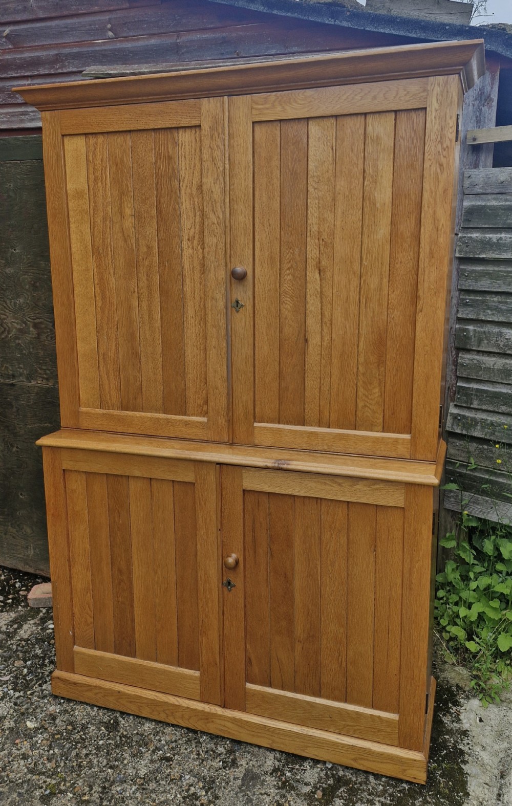 Useful 2 part oak housekeepers cupboard. 