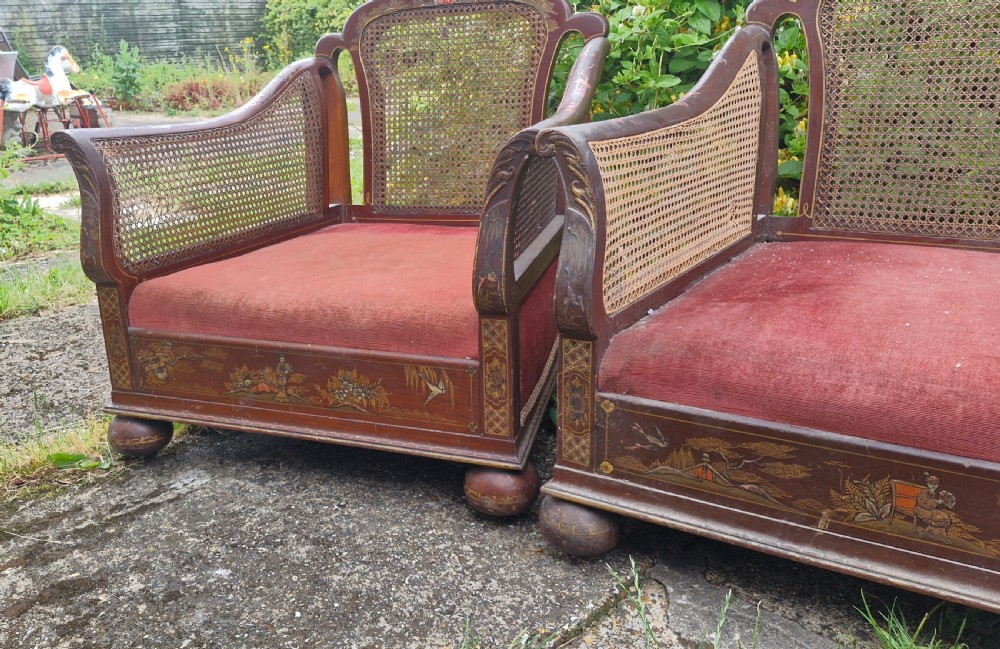 A set of three low-built chinoiserie bergere armchairs featuring hand-painted lacquered frames, woven cane backs and sides, and red velvet seats. View XI