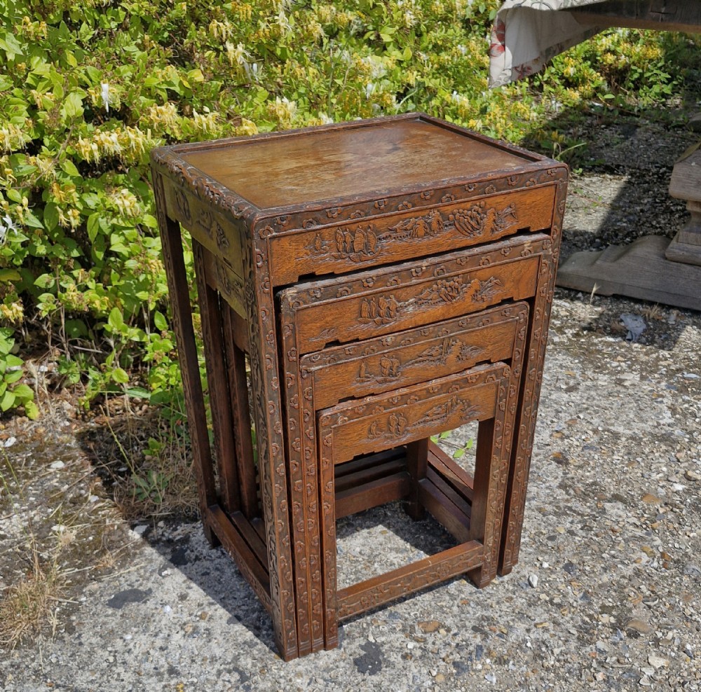 Nest of 4 Oriental occasional tables.