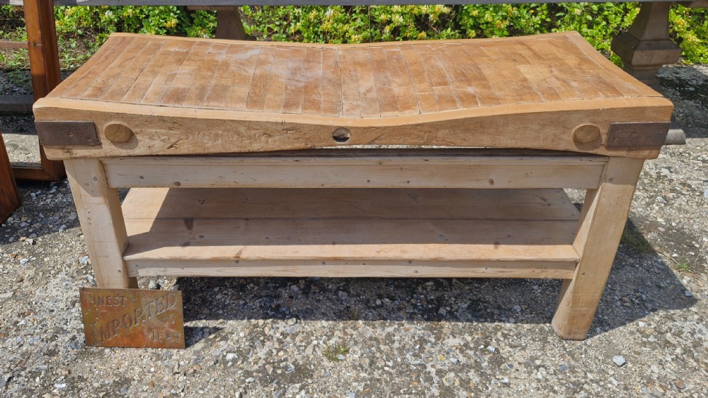 Large butchers block on stand.