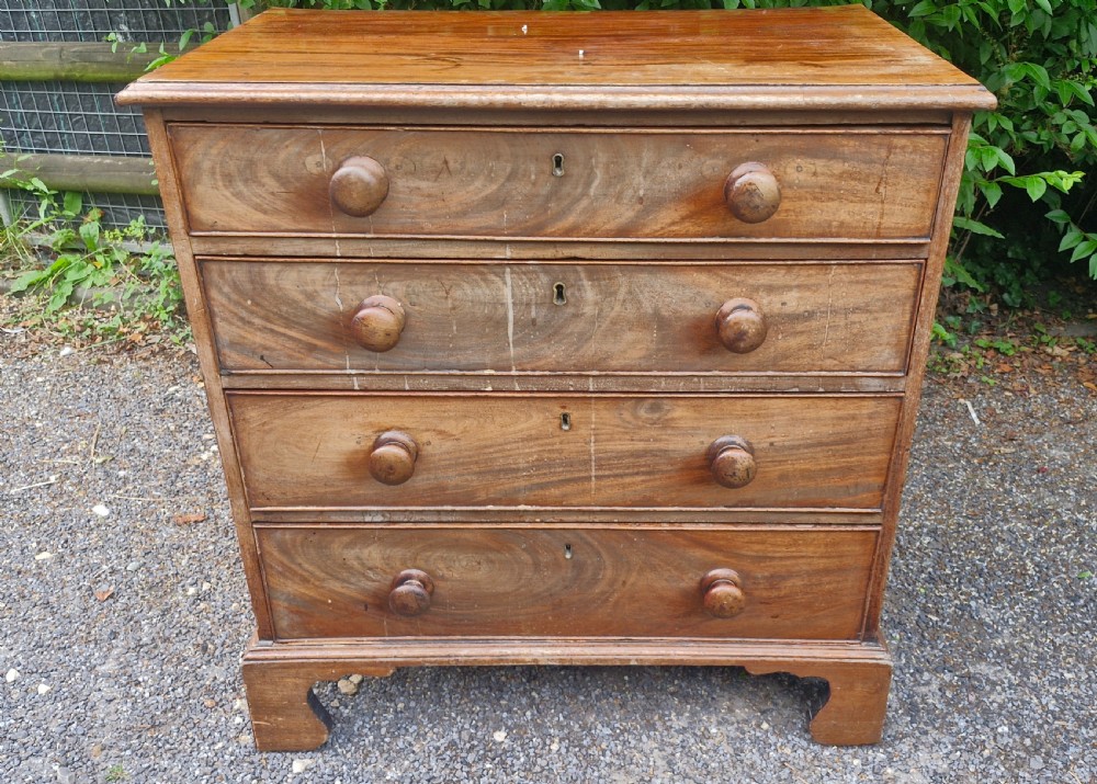 Neat and compact early 19th century mahogany chest of drawers.  View VIII