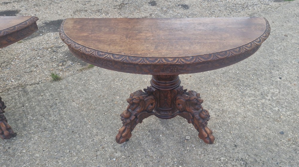Pair of Victorian Gothic carved oak console tables.  View IV