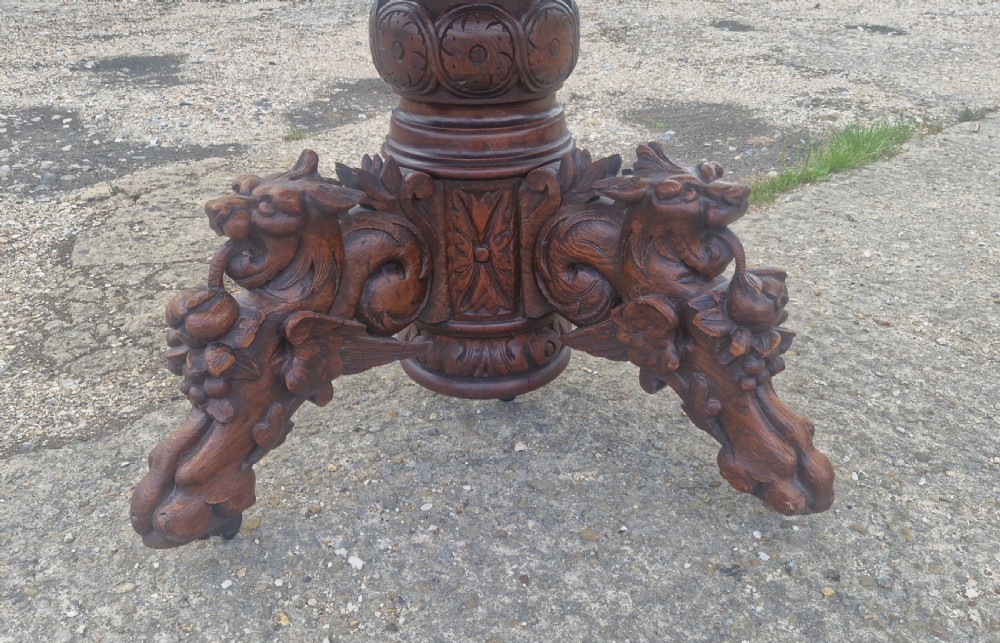 Pair of Victorian Gothic carved oak console tables.  View V