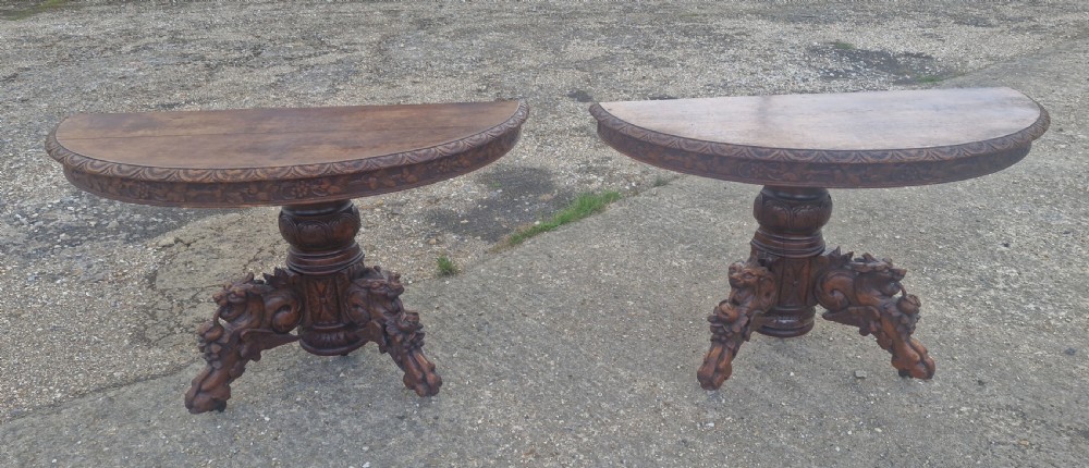 Pair of Victorian Gothic carved oak console tables.  View VII