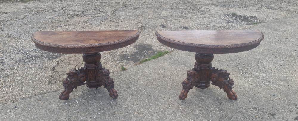 Pair of Victorian Gothic carved oak console tables.  View VIII