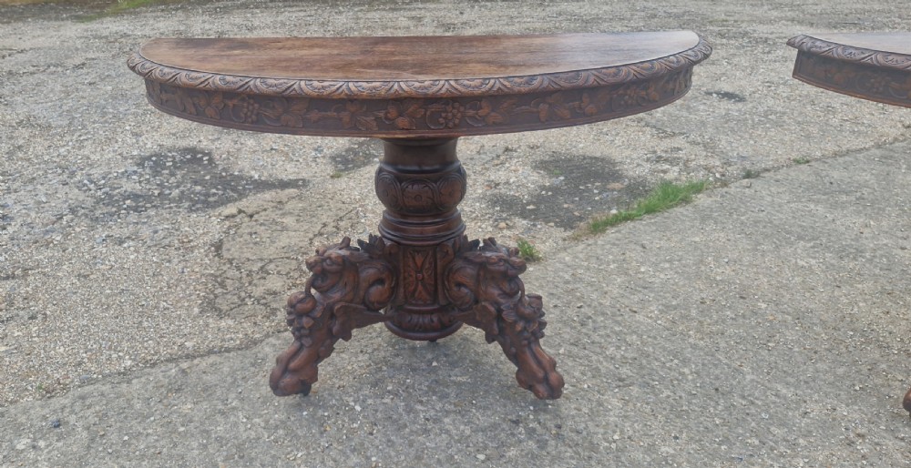 Pair of Victorian Gothic carved oak console tables.  View IX