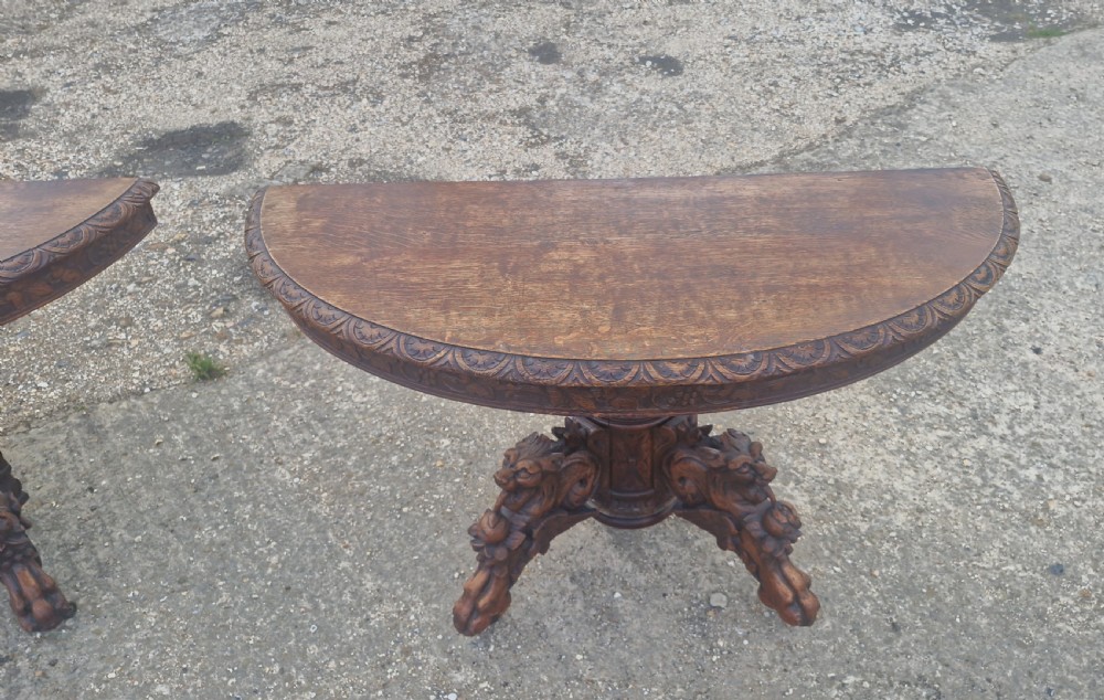 Pair of Victorian Gothic carved oak console tables.  View XI