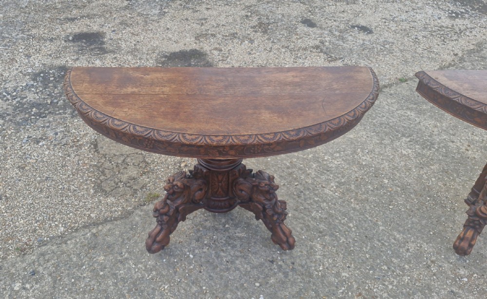 Pair of Victorian Gothic carved oak console tables.  View XII