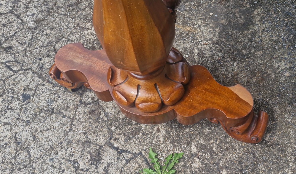 A mid-19th-century mahogany kidney-shaped side table featuring turned pedestal supports, a carved scrolled stretcher, and shaped feet. View VIII