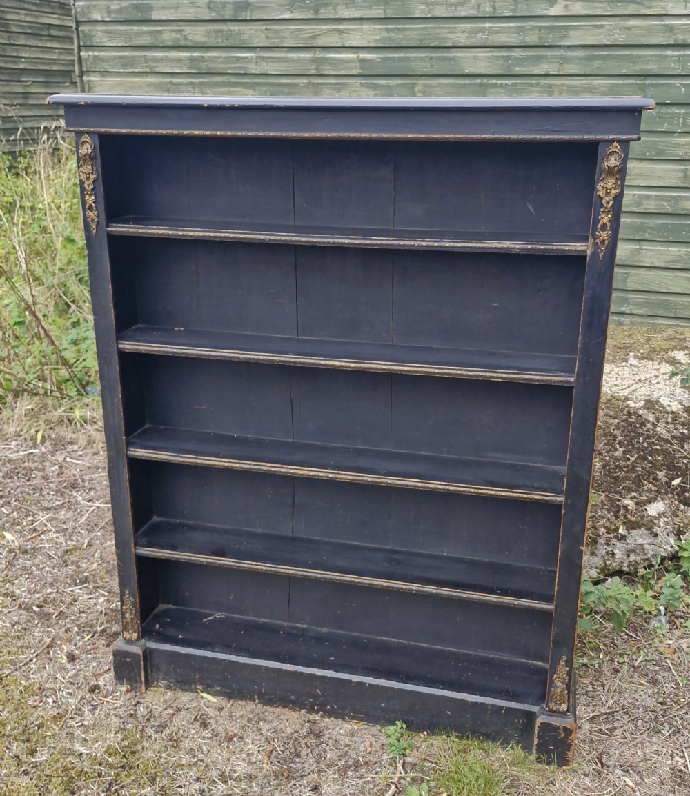 Victorian gilt metal mounted ebonised open bookcase. 