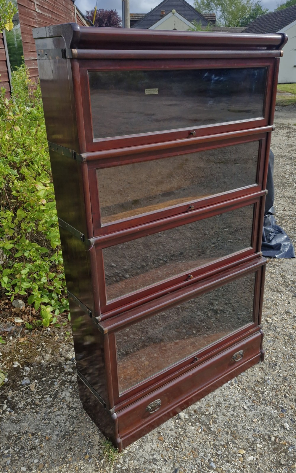 Mahogany 4 section Globe Wernicke bookcase with drawer to base.