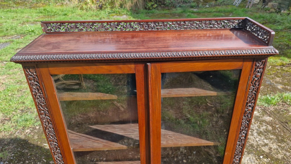 Pair of 19th century carved Anglo Indian bookcase cabinet.  View XV