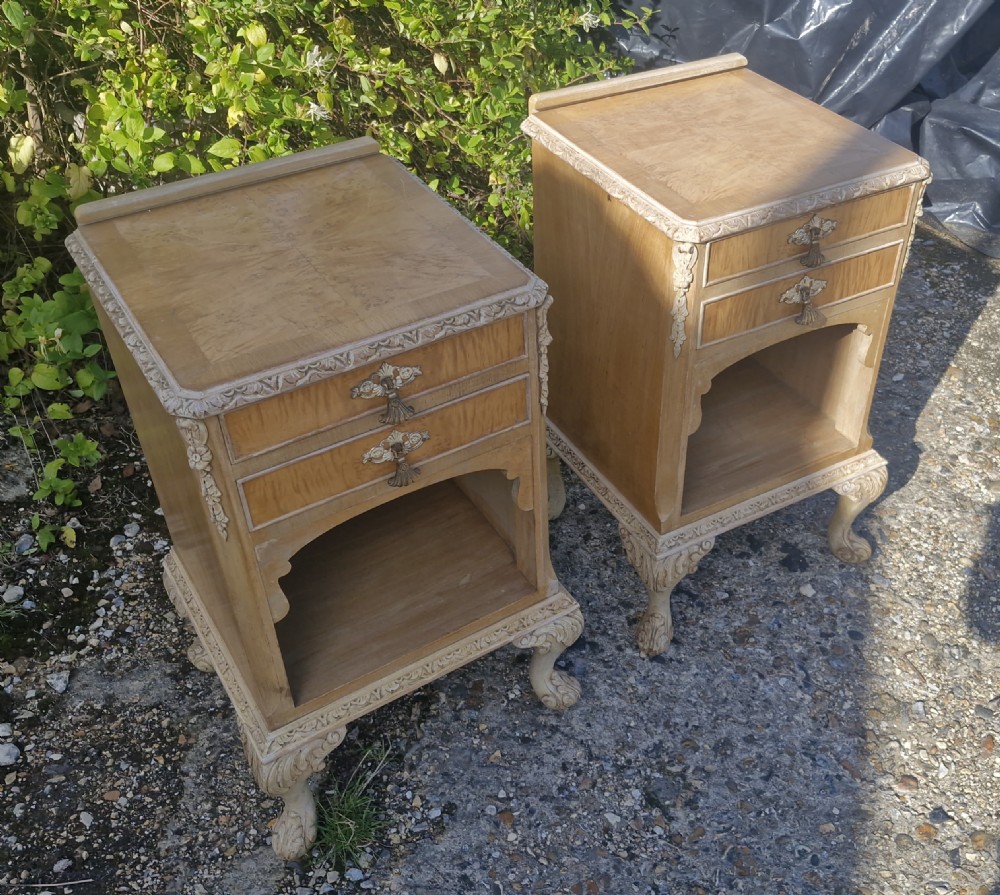 Pair of carved and walnut bedside cabinets. 