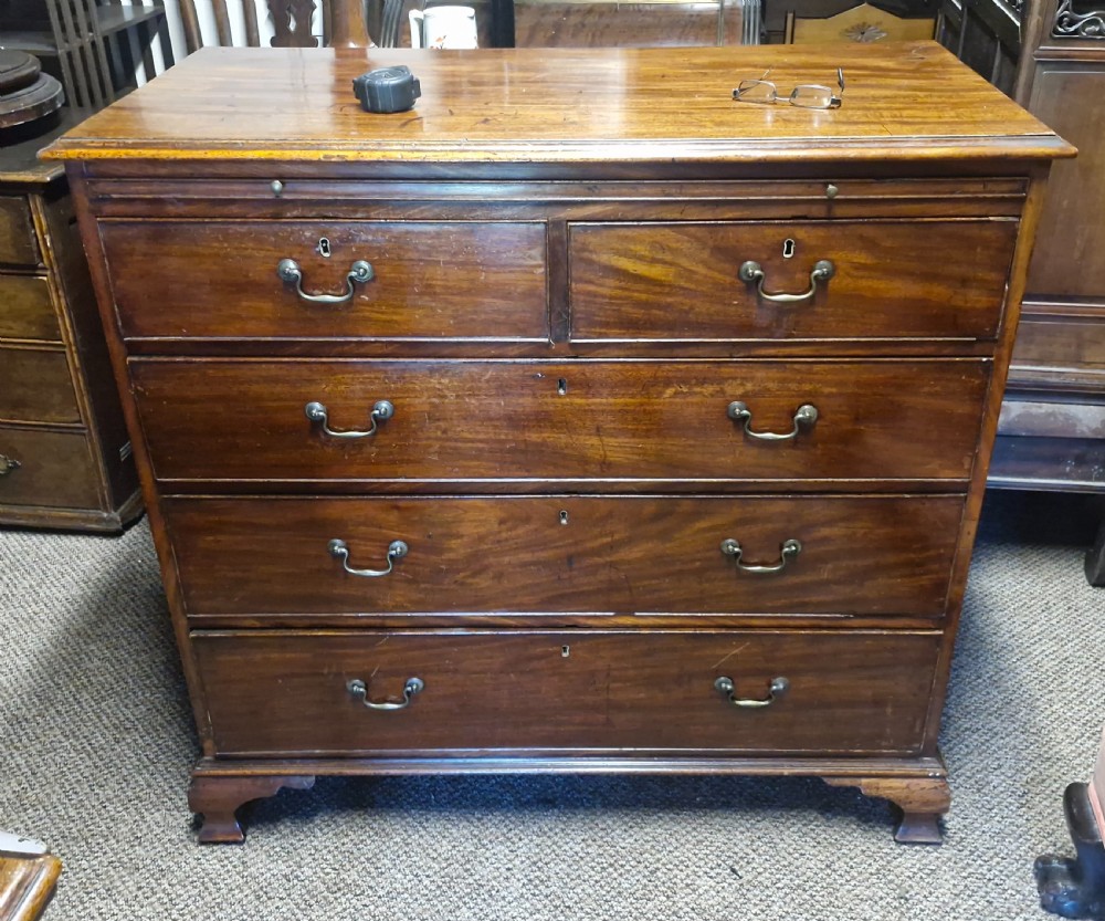 Early 19th century mahogany chest of drawers with brushing slide. View IV