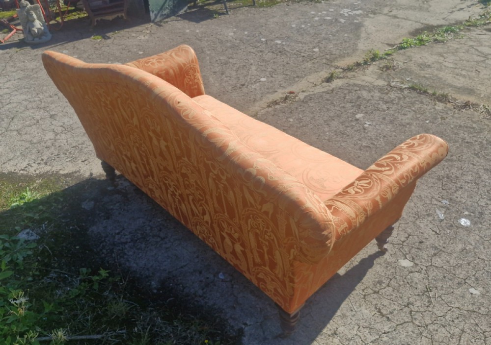 Late Victorian upholstered sofa on mahogany turned legs. View II