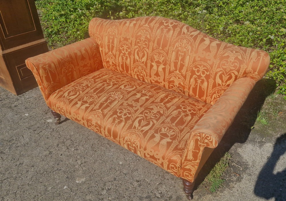 Late Victorian upholstered sofa on mahogany turned legs. View III