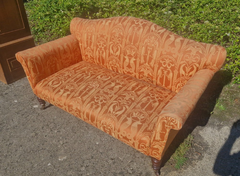 Late Victorian upholstered sofa on mahogany turned legs. View IV