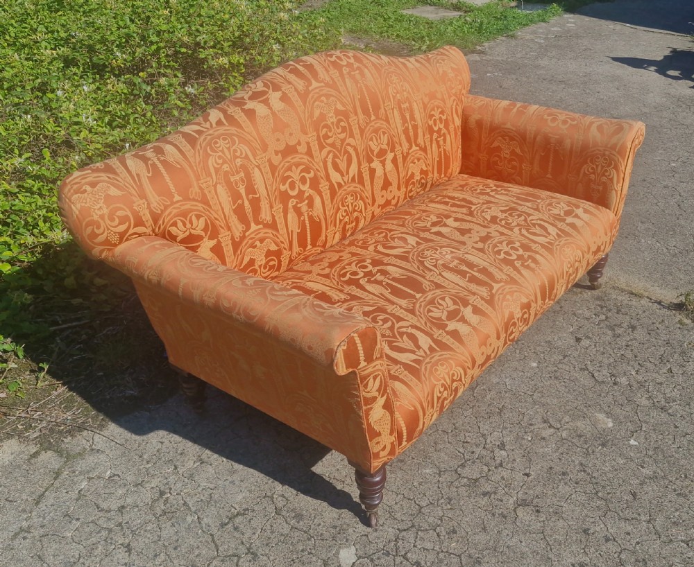 Late Victorian upholstered sofa on mahogany turned legs. View V