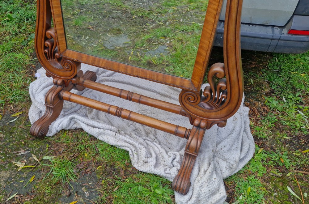 A large Regency mahogany cheval dressing mirror featuring a tilting rectangular frame set between carved scroll uprights and turned stretchers. View III