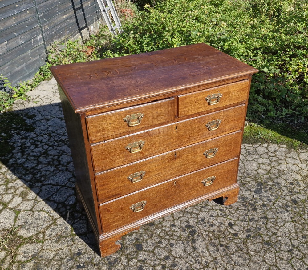 Mid 18th century oak chest of drawers.  View VI