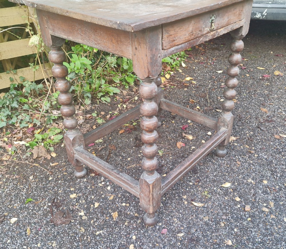 Georgian oak bobbin leg single drawer side table. View VI