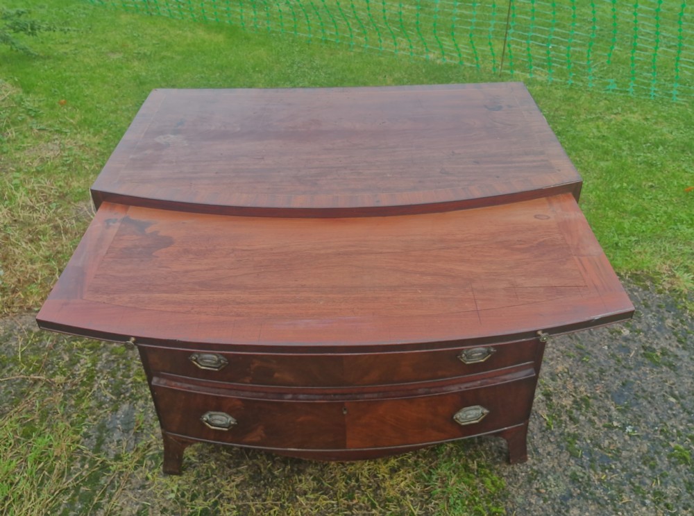 Regency mahogany bow front chest with brushing slide.  View III