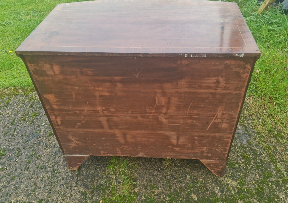 Regency mahogany bow front chest with brushing slide.  View V
