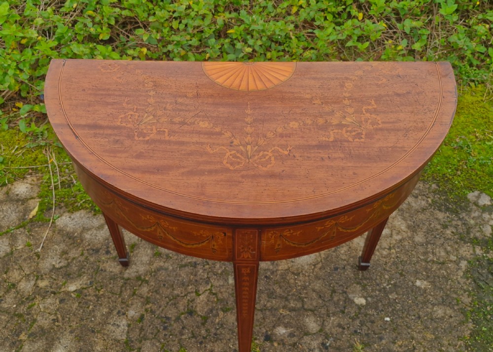 Edwardian inlaid mahogany demi lune games table. Makers stamp.  View X