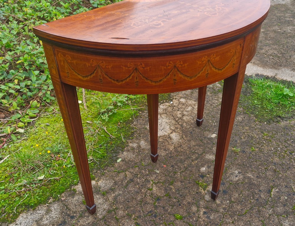 Edwardian inlaid mahogany demi lune games table. Makers stamp.  View XIII