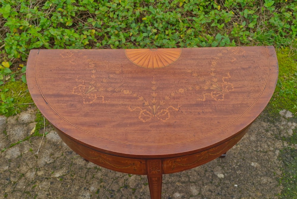 Edwardian inlaid mahogany demi lune games table. Makers stamp.  View XIV