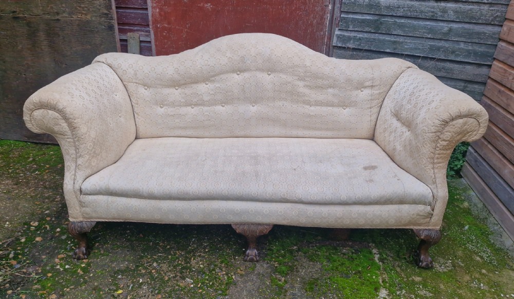 Edwardian upholstered camel Back Sofa on ball and claw feet.  View II