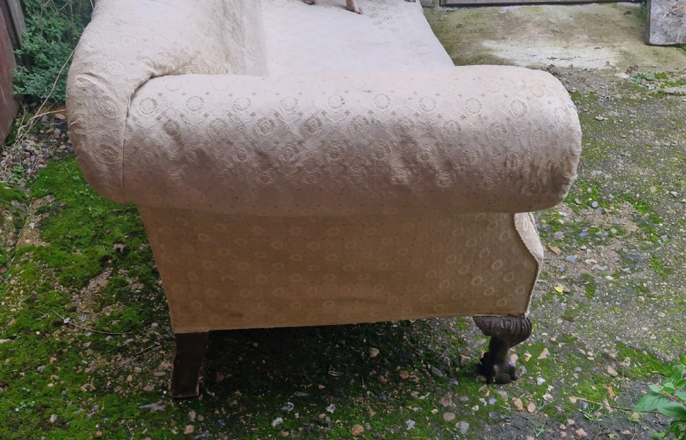 Edwardian upholstered camel Back Sofa on ball and claw feet.  View III