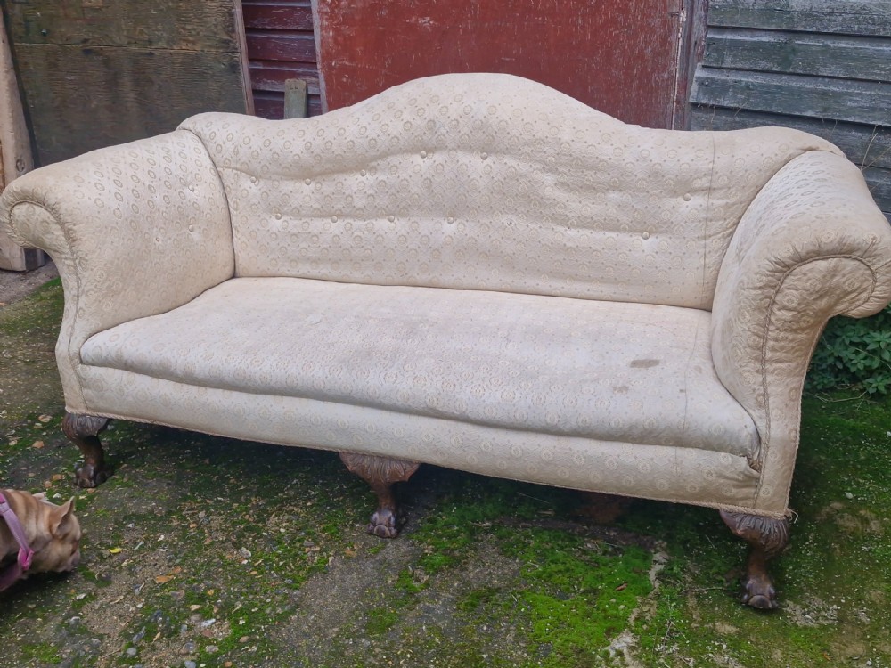 Edwardian upholstered camel Back Sofa on ball and claw feet.  View IV
