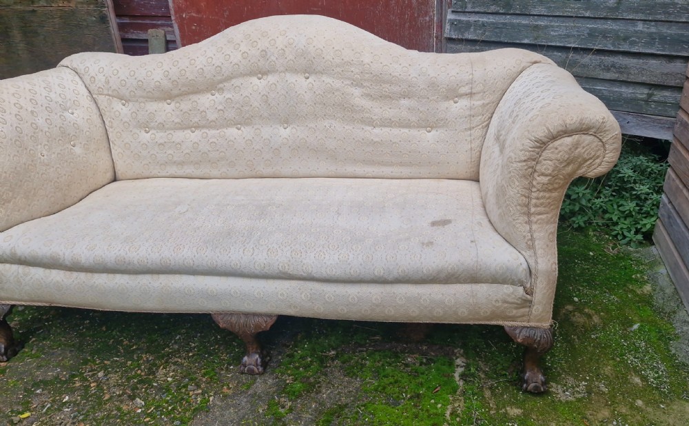 Edwardian upholstered camel Back Sofa on ball and claw feet.  View V