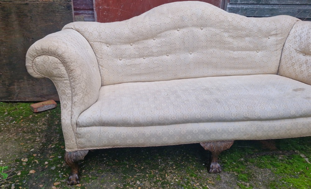 Edwardian upholstered camel Back Sofa on ball and claw feet.  View VI