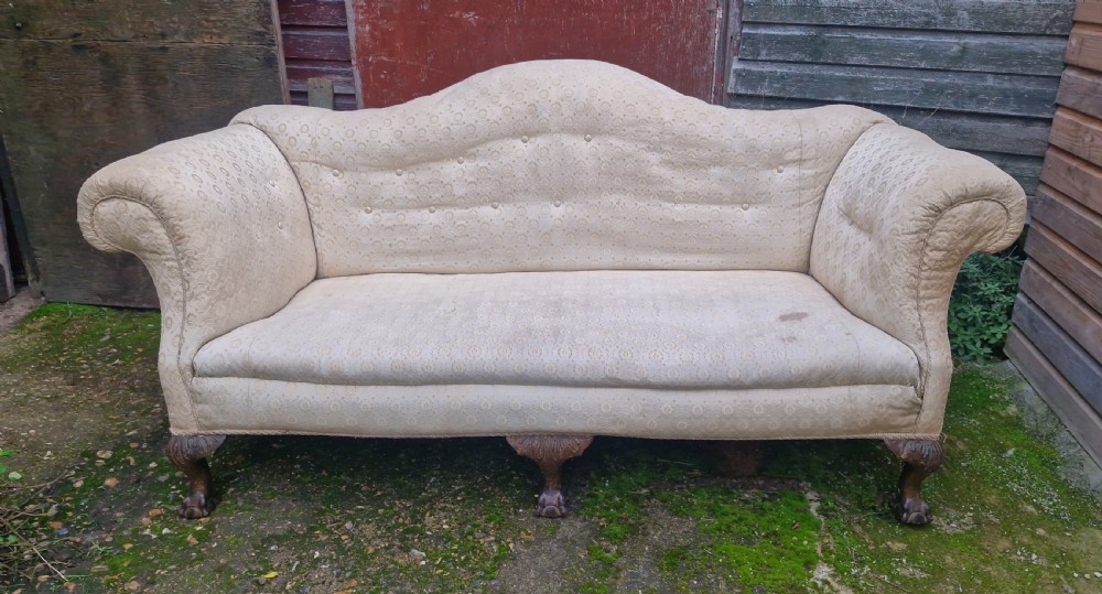 Edwardian upholstered camel Back Sofa on ball and claw feet.  View VII