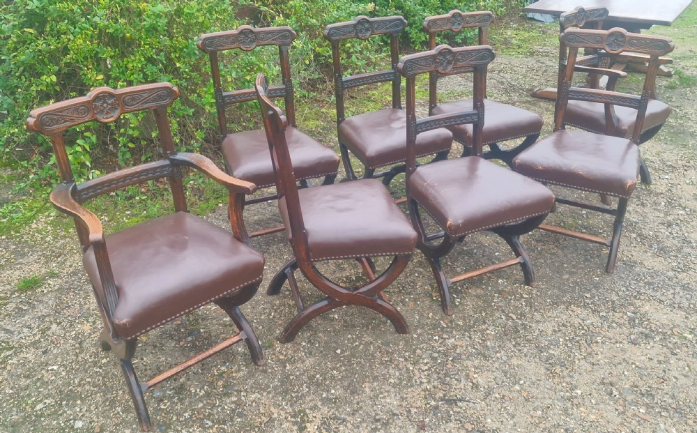 Set of 8 Victorian carved oak Gothic X frame dining chairs . View V