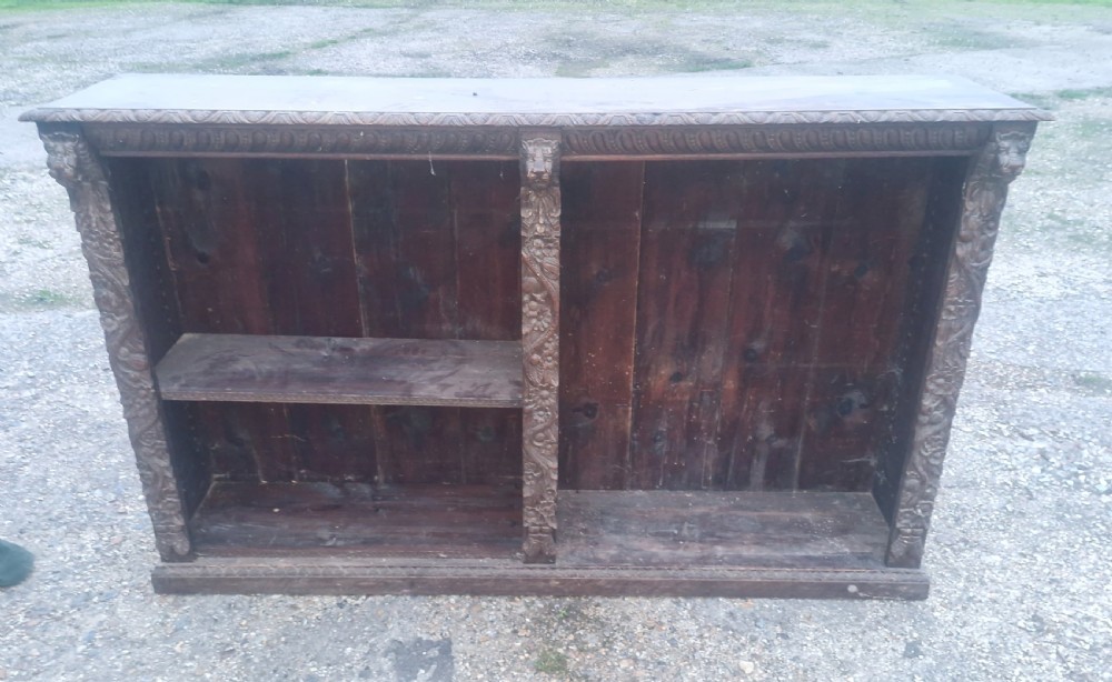 Late Victorian carved oak open bookcase. 