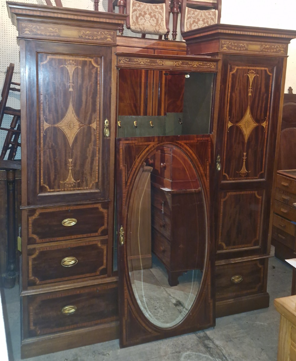 Edwardian inlaid mahogany triple wardrobe. 