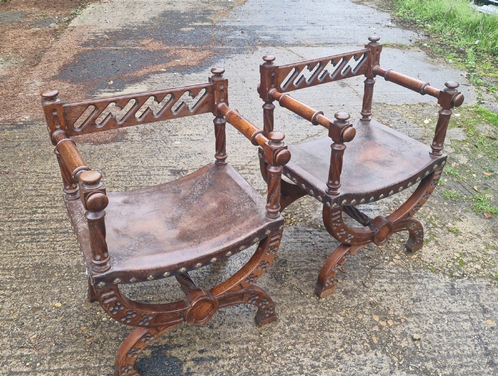 Pair of Late Victorian oak and leather hall armchairs