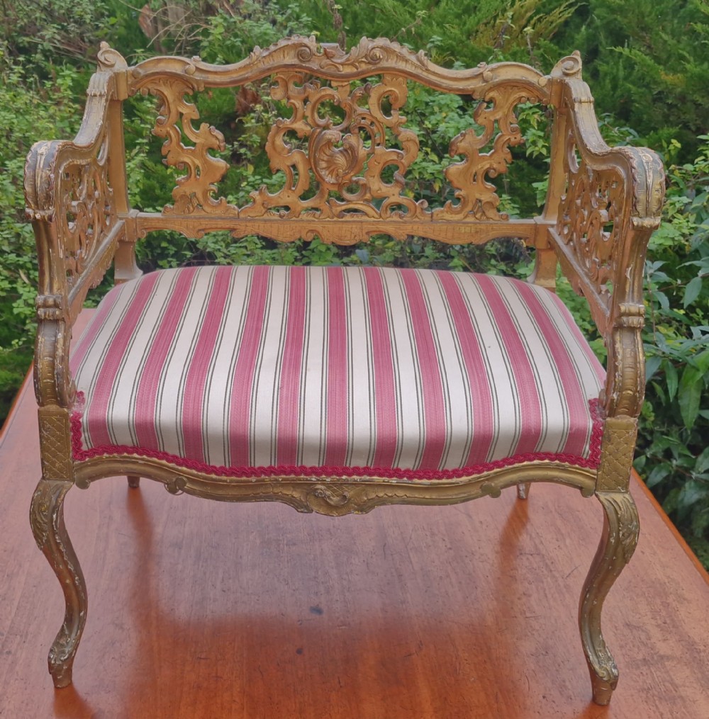 Carved gilt window seat. 