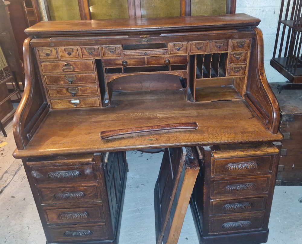 Good large oak roll top pedestal desk. View V
