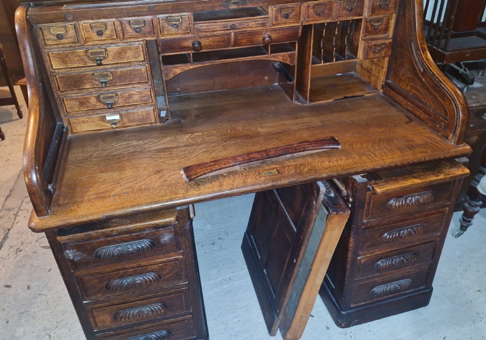 Good large oak roll top pedestal desk. View IX