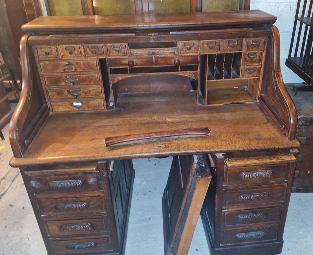 Good large oak roll top pedestal desk. View XIII
