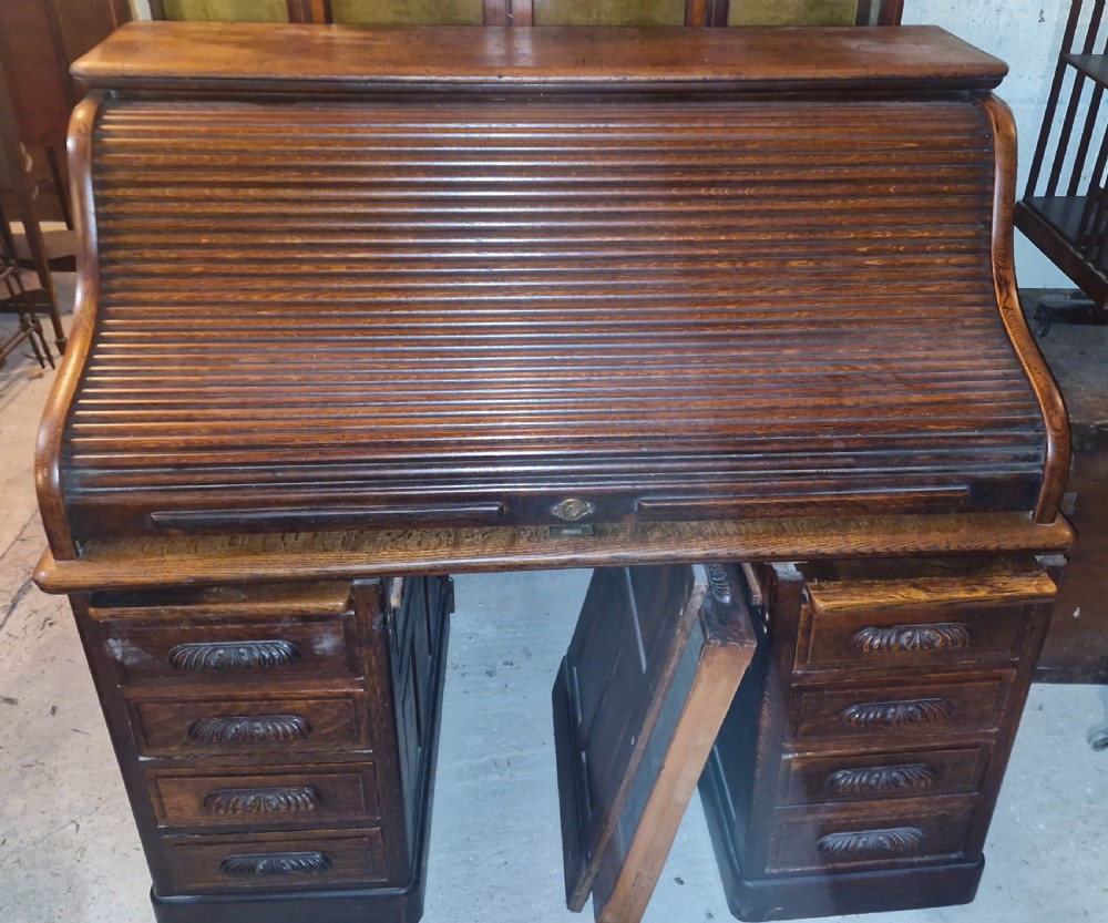 Good large oak roll top pedestal desk. View XV