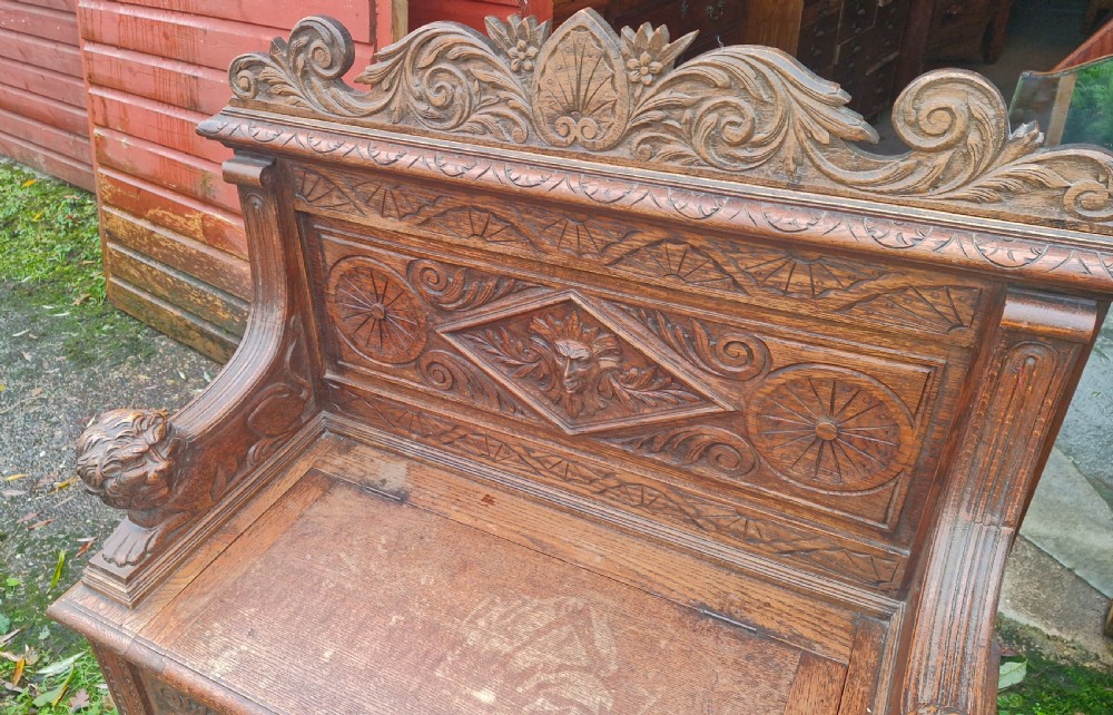 Victorian carved oak hall seat. View XII