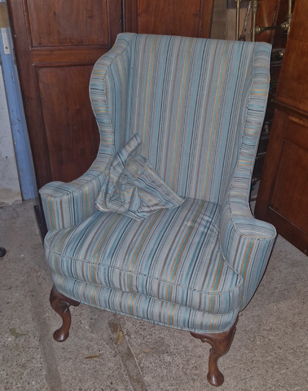 Wing back upholstered armchair. 