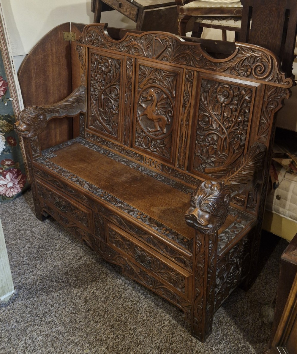 Carved oak Welsh hall seat.