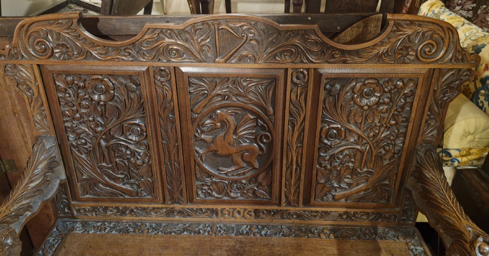 Carved oak Welsh hall seat. View VII