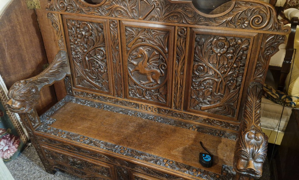 Carved oak Welsh hall seat. View VIII